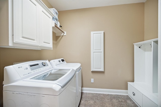 laundry room featuring cabinets and independent washer and dryer