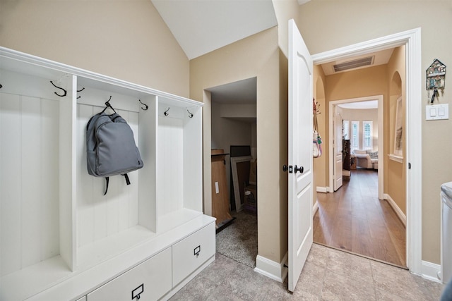 mudroom with vaulted ceiling