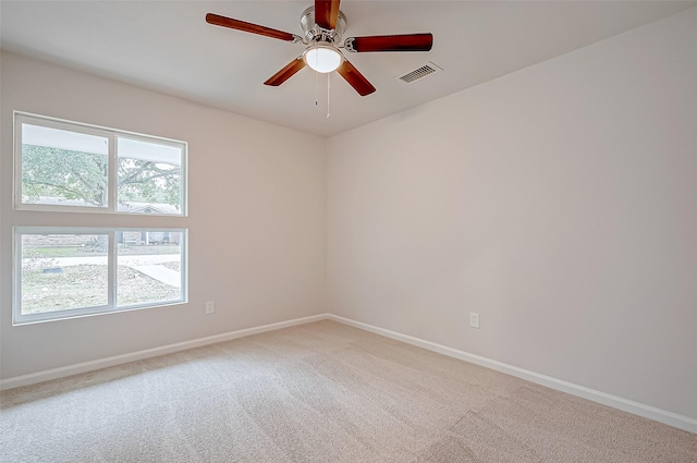 carpeted empty room with ceiling fan