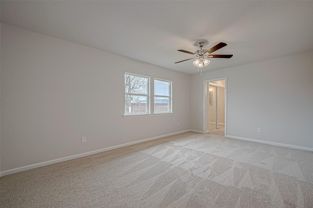 carpeted empty room with ceiling fan