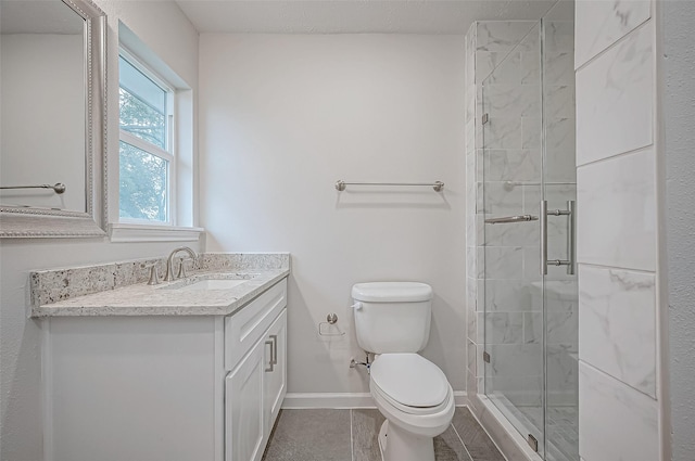 bathroom with walk in shower, tile patterned floors, vanity, and toilet