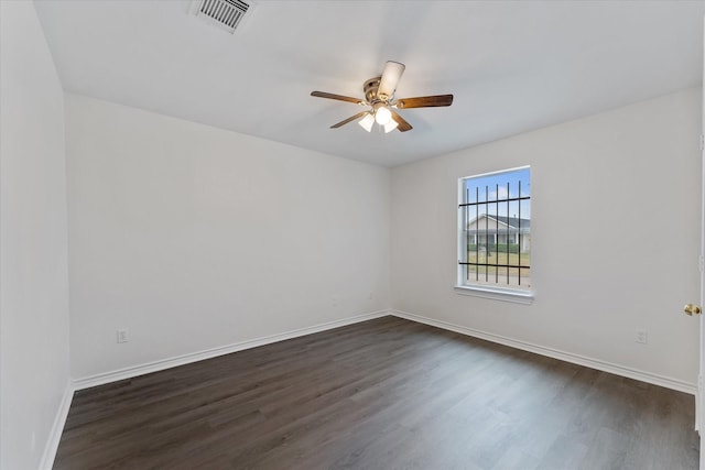 unfurnished room featuring ceiling fan and dark hardwood / wood-style floors