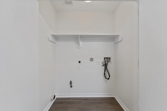 laundry area featuring gas dryer hookup, hookup for a washing machine, dark wood-type flooring, and hookup for an electric dryer