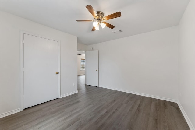 unfurnished bedroom with ceiling fan and hardwood / wood-style floors