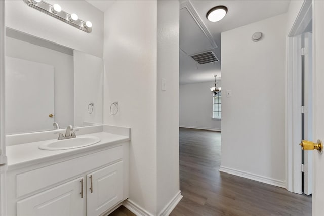 bathroom featuring hardwood / wood-style flooring and vanity