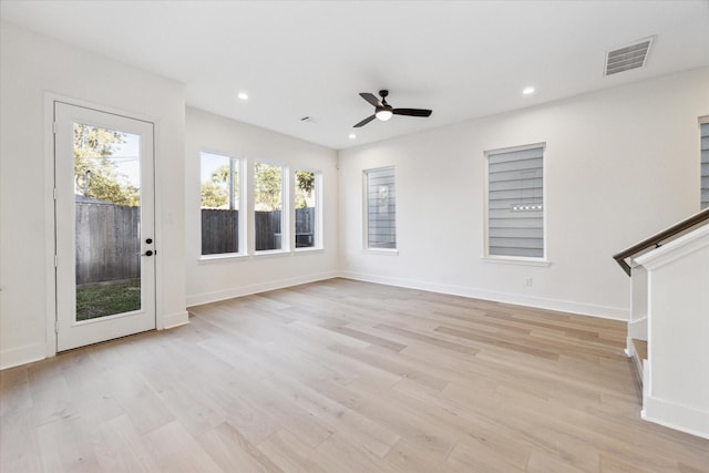 unfurnished living room with ceiling fan and light wood-type flooring