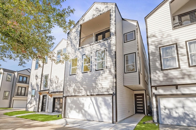 multi unit property featuring a garage