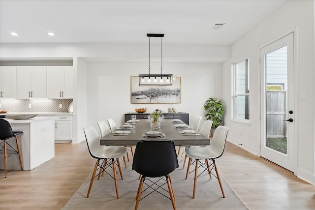 dining room with light hardwood / wood-style flooring