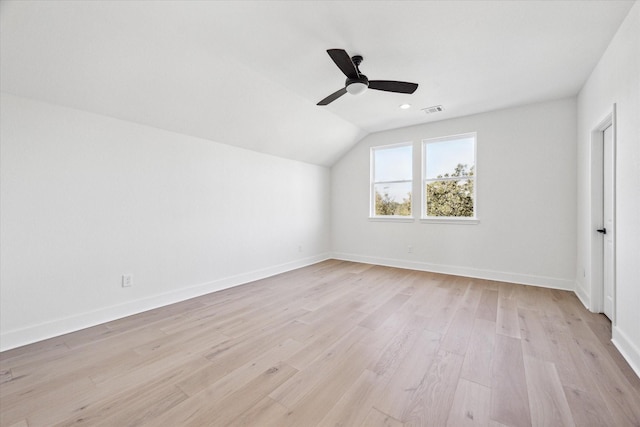 interior space featuring light wood-type flooring, ceiling fan, and vaulted ceiling