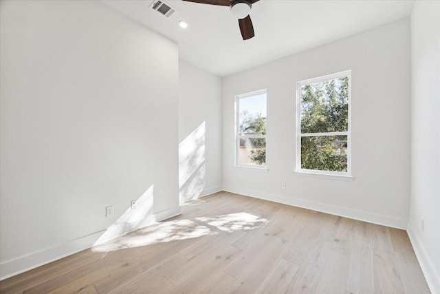 unfurnished room with ceiling fan and light hardwood / wood-style flooring