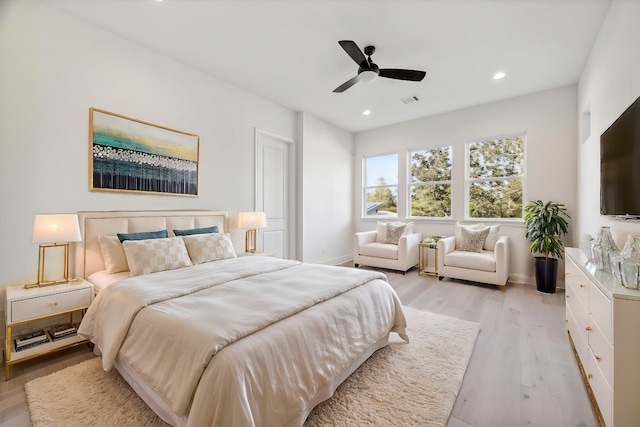 bedroom with ceiling fan and light wood-type flooring