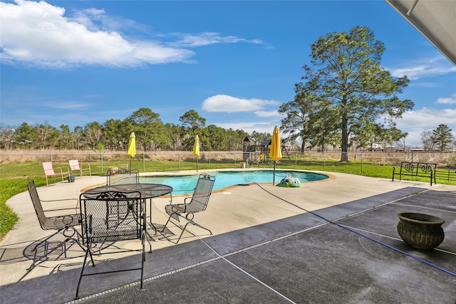 view of pool with a patio area, fence, and a fenced in pool