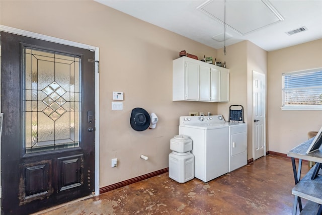 laundry area with cabinet space, attic access, visible vents, baseboards, and separate washer and dryer