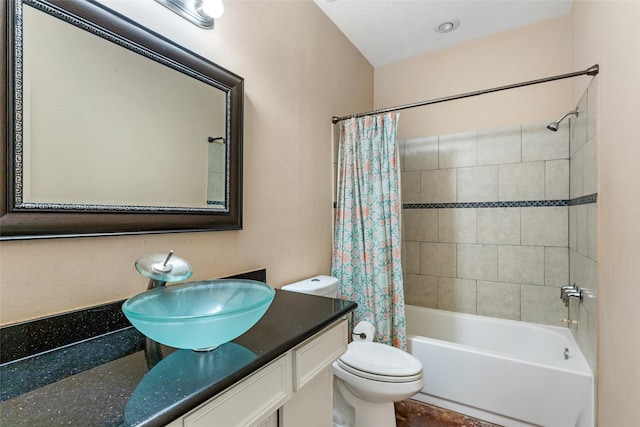 bathroom with toilet, shower / bathtub combination with curtain, and vanity