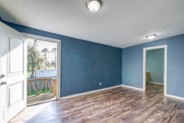 empty room featuring hardwood / wood-style flooring