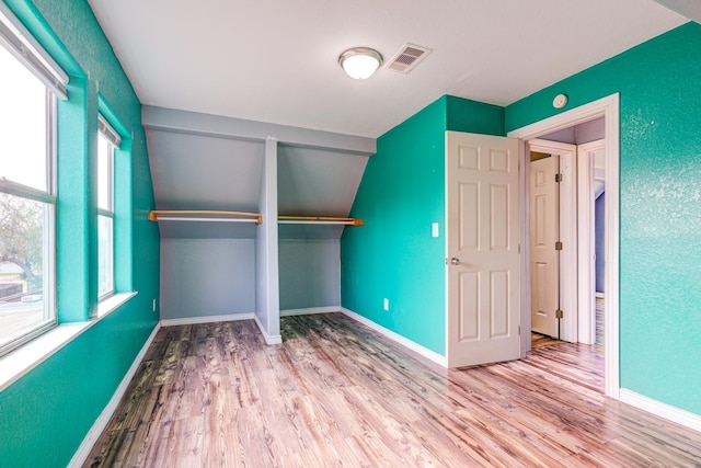 unfurnished bedroom featuring a closet and light hardwood / wood-style floors