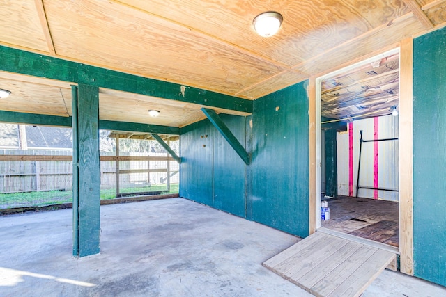 unfurnished room featuring concrete floors