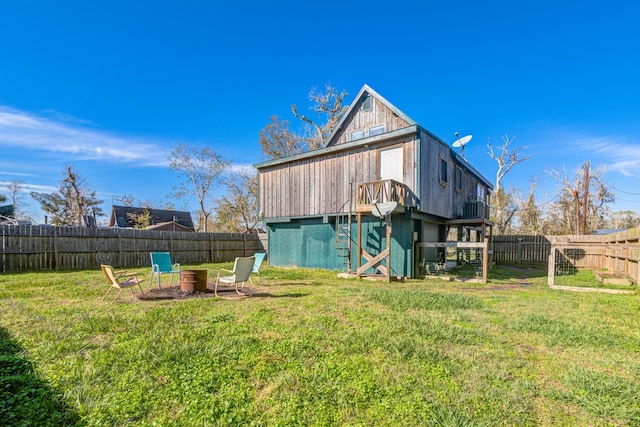 back of house with a lawn