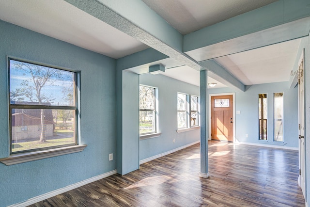 spare room with dark hardwood / wood-style floors