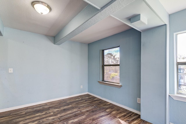 spare room featuring dark hardwood / wood-style floors