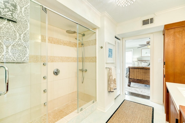 bathroom with an enclosed shower, ceiling fan, crown molding, and vanity