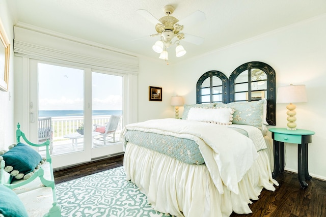 bedroom with access to outside, a water view, ceiling fan, ornamental molding, and dark wood-type flooring