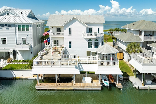 back of property with a water view