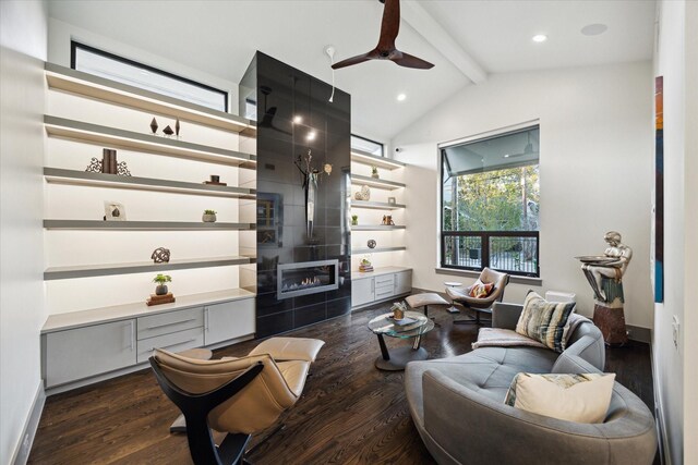 living room featuring ceiling fan, vaulted ceiling with beams, and dark wood-type flooring