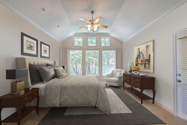 carpeted bedroom featuring ceiling fan, vaulted ceiling, and ornamental molding