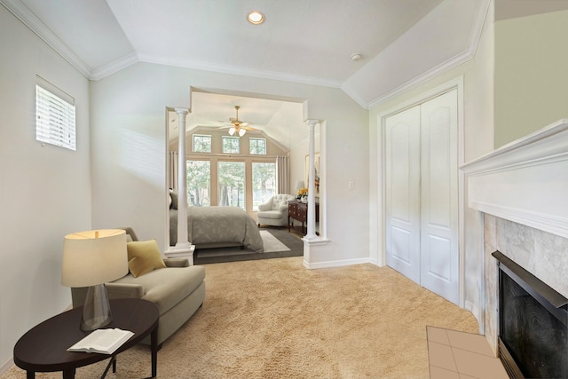 9051 Forest Cliff Ct, Conroe, TX 77302 - sitting room featuring vaulted ceiling, a fireplace, ornate columns, a ceiling fan, and crown molding