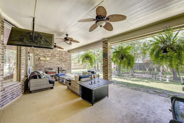 view of patio with ceiling fan and an outdoor living space