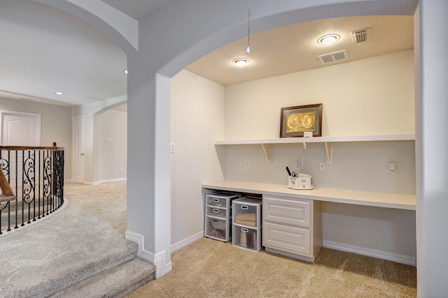 9051 Forest Cliff Ct, Conroe, TX 77302 - bar area featuring light carpet, arched walkways, baseboards, pendant lighting, and recessed lighting