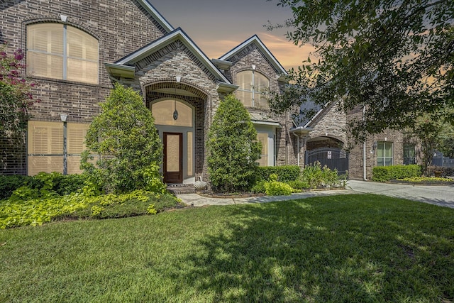 french country style house with a yard