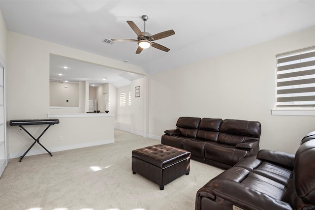 living room featuring light carpet and ceiling fan