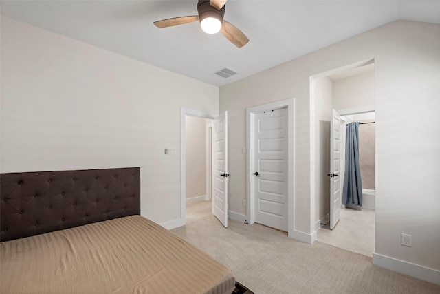 unfurnished bedroom with ceiling fan and light colored carpet