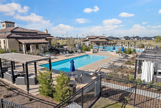 view of pool with a pergola and a patio area