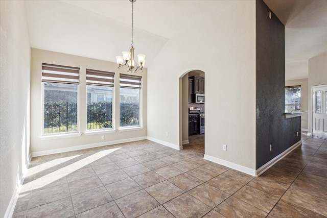 unfurnished dining area featuring tile patterned flooring, vaulted ceiling, and a chandelier