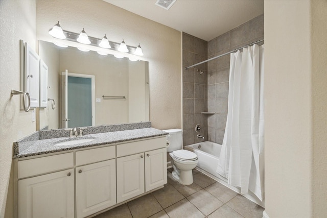 full bathroom with shower / bathtub combination with curtain, vanity, tile patterned floors, and toilet