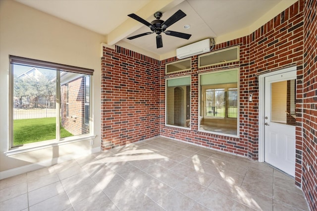 view of patio with a wall unit AC and ceiling fan