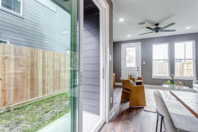 sunroom / solarium featuring ceiling fan