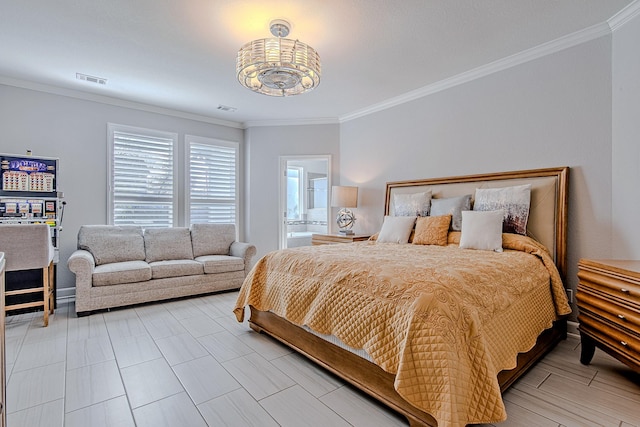 bedroom with ornamental molding and ensuite bathroom