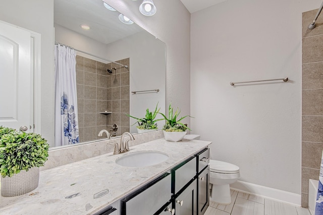 bathroom with curtained shower, tile patterned floors, vanity, and toilet