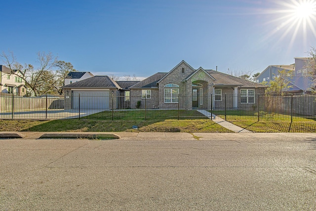 single story home featuring a front yard and a garage