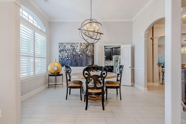 dining space with an inviting chandelier, ornamental molding, and a wealth of natural light