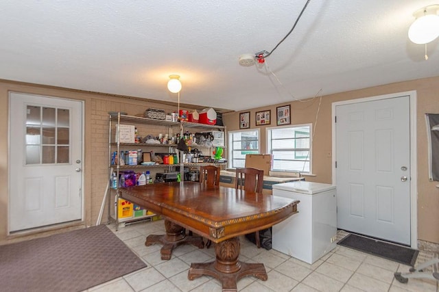 dining area with a textured ceiling