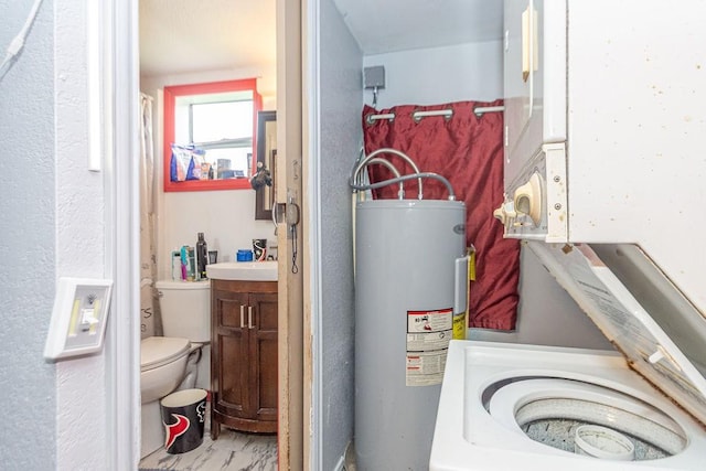 utility room with electric water heater and sink