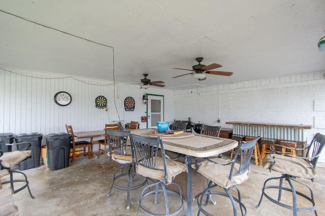 view of patio with ceiling fan and an outdoor bar