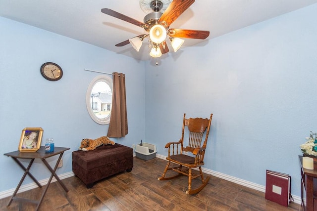 sitting room featuring ceiling fan and dark hardwood / wood-style flooring