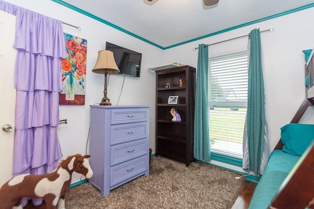 bedroom featuring carpet flooring, ceiling fan, and crown molding