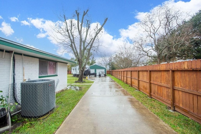 view of yard with central AC